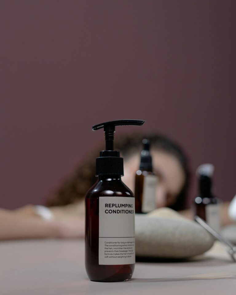 Elegant studio shot of an organic replumping conditioner with focus on the bottle.